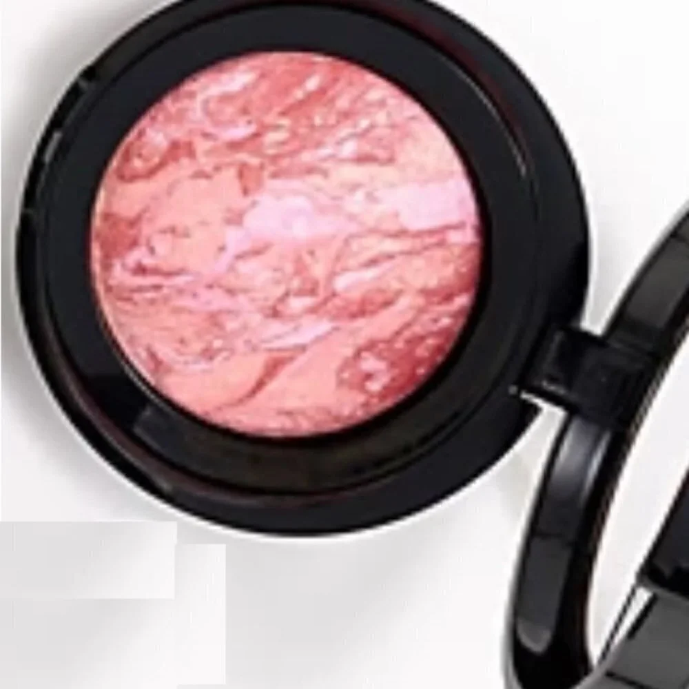 Laura Geller Blush-N-Brighten in TROPIC HUES, swirls of coral, pink, and…